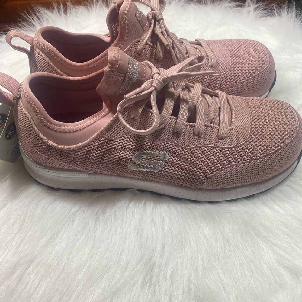 Skechers Industrial composite toe textile upper rubber sole.